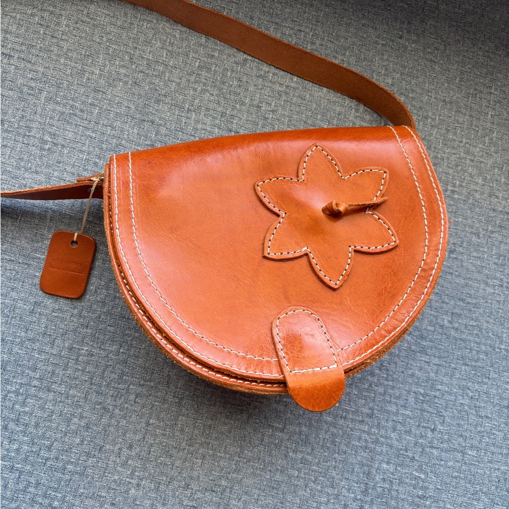 Elegant Tan Leather Crossbody Bag with Floral Accent NWT